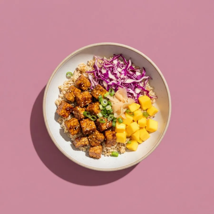 Sticky tempeh bowl with red cabbage and mango